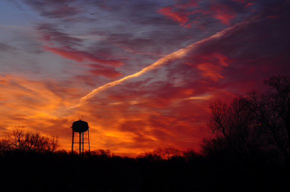 Sunrise with Water Tower and Contrail